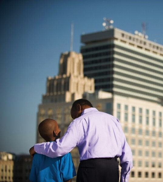 father and son overlooking city of winston salem skyline